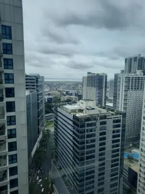 an aerial view of a city with tall buildings at Bonifacio global city one uptown residence-2 Bedroom in Manila
