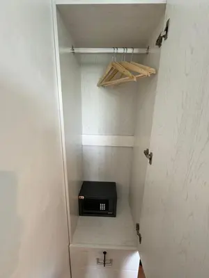 a walk in closet with a black appliance in it at Modern Oasis: Pool + Netflix in Manila