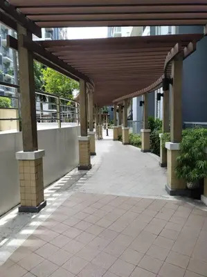 an empty hallway of a building with a wooden roof at Modern Condo Infront of NAIA T3 (Virluxe Suites) in Manila
