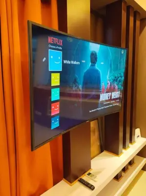 a flat screen tv sitting on top of a shelf at Modern Condo Infront of NAIA T3 (Virluxe Suites) in Manila