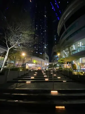 a group of stairs in front of a building at night at Frost at Air Residences Makati in Manila
