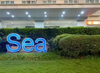a sign for a sea sign in front of a building at Madison Place at Sea Residences powered by Cocotel in Manila