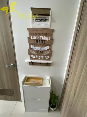 a bathroom with a sign that reads enjoy the little things in life the big things at Re Lux Staycation, NEAR NAIA in Manila
