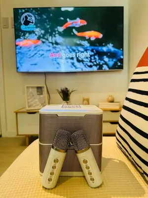 a suitcase on a bed with two ties on it at Azure Urban Resort Residences Paranaque 2 Bedroom Unit in Manila