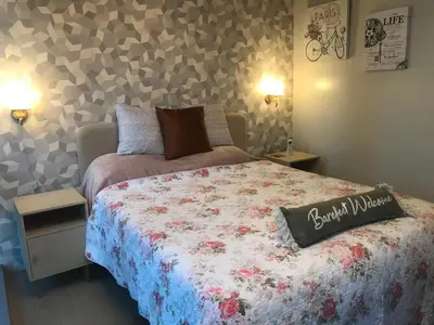 a bedroom with a bed with a comforter on it at Angelheaven EGPLR in Manila