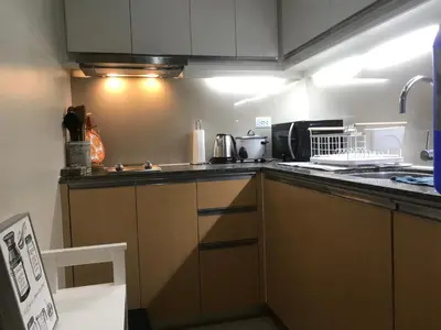 a kitchen with a stove and a counter top at Angelheaven EGPLR in Manila