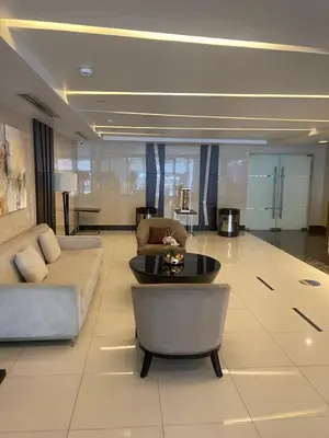 a living room with a couch and a table at Cozy Staycation Condo for Family in Ermita in Manila