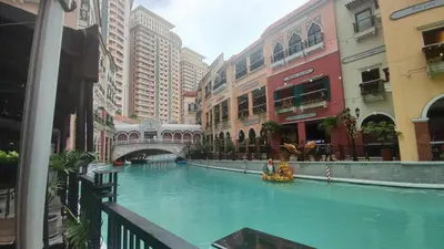 a pool in the middle of a city with buildings at 11B Tower 1 Viceroy Residences Mc Kinley Hill BGC in Manila