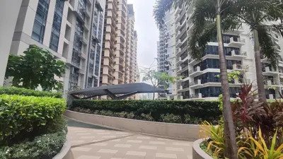 a walkway in the middle of two tall buildings at 11C Tower 1 Viceroy Residences McKinley BGC in Manila