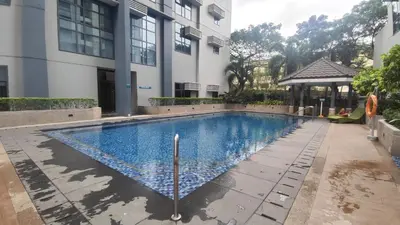 a swimming pool in front of a building at 11C Tower 1 Viceroy Residences McKinley BGC in Manila
