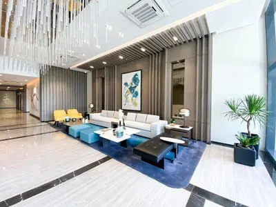 a living room with a couch and a table at Uptown Parksuites Tower Two - BGC Taguig, Manila in Manila