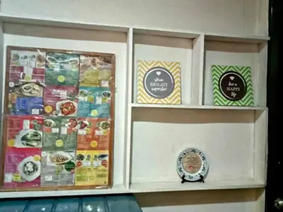 a display cabinet filled with different types of food at Matthew's Private Pool by Mia and Miguel's House in General Trias
