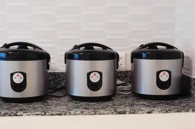 three crock pots sitting on a kitchen counter at Makati Altean Apartment (Delfin Room) in Manila