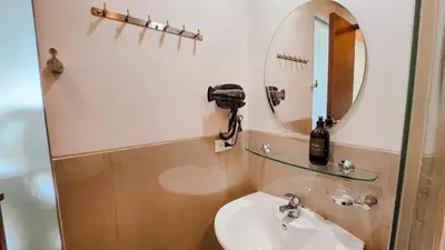 a bathroom with a sink and a mirror at The Beacon Condo - Studio Tower 1 in Manila