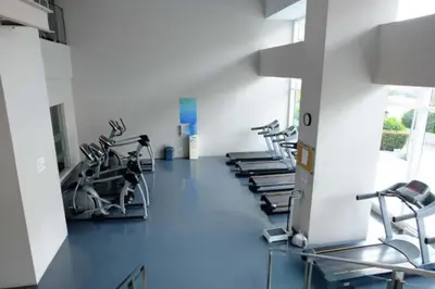 a gym with treadmills and elliptical machines at The Beacon Condo - Studio Tower 1 in Manila