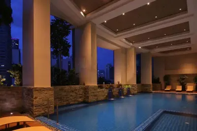 a swimming pool in a hotel at night at KL Tower Condo, Makati City in Manila