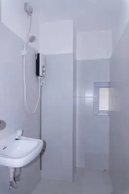 a white bathroom with a shower and a sink at Maria Deck Urban Glamping in Manila