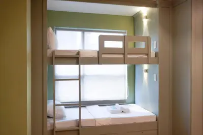 a room with a bunk bed with a window at ALTEAN Apartments - Lourdes Room in Manila
