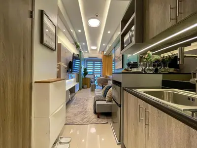 a small kitchen with a sink and a couch at SMDC Fame Residence luxurious family suite condo near mrt in Manila