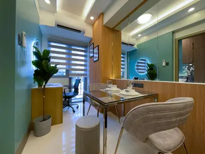 a dining room with a table and chairs at SMDC Fame Residence luxurious family suite condo near mrt in Manila