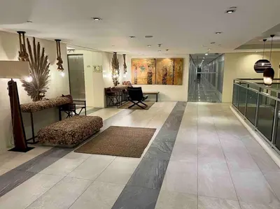 a large lobby with a couch and a table at Azure cozy corners in Manila