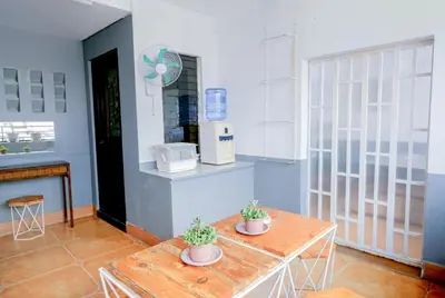 a room with two potted plants on a table at House of Citiflora Unit B in Manila
