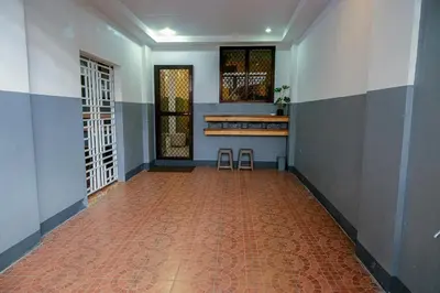 an empty hallway with two stools in a room at House of Citiflora Unit B in Manila