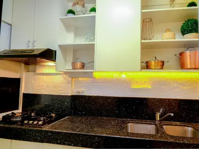a kitchen with a sink and a counter top at House of Citiflora Unit B in Manila