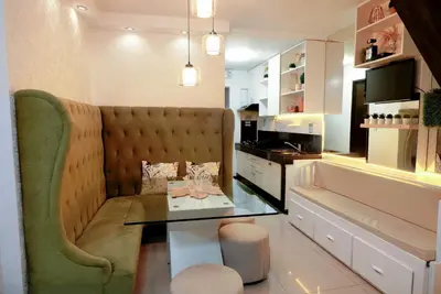 a living room with a couch and a table at House of Citiflora Unit B in Manila