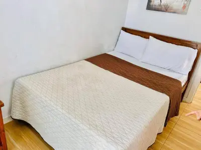 a bed in a small room with a white bed at Azure Urban Resort a13 near airport wavepool in Manila