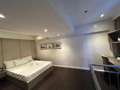 a bedroom with a white bed in a room at Melbourne makati in Manila