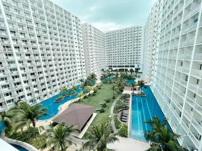 an aerial view of a resort with a swimming pool at Shabby Chic & Contemporary Condo in Manila