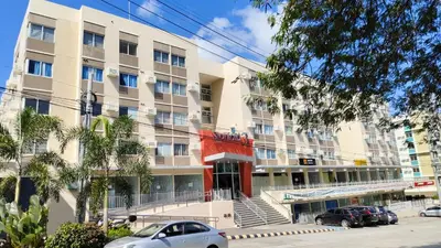 an apartment building with cars parked in front of it at J Studio - Fast WiFi, 55