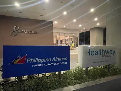 a sign in front of a building at 8 Adriatico - 1 Bedroom with 1 Parking Space near SLMEC, PGH and US Embassy in Manila