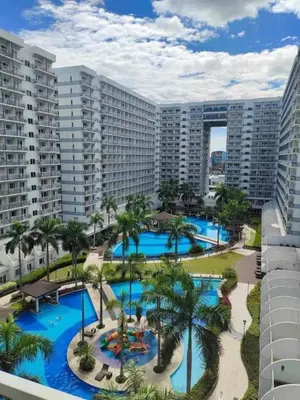 an aerial view of the pool at the resort at Triple 3D Shell Residences in Manila