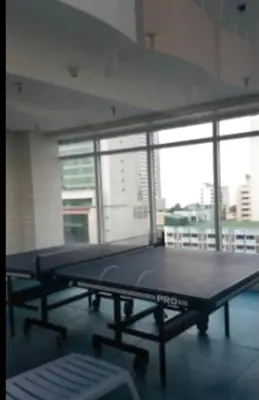 a large ping pong table in a room with windows at Experience OCEAN VIEW Rooms in The Heart Of Manila, Enjoy FREE ACCESS To The POOL, SAUNA, PLUS MASSAGE PROMO In Prime Location Near The US Embassy, NAIA, Makati, BGC, Mall of Asia, And Chinatown This Is A Limited-Time Offer, Book Now in Manila