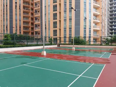 a tennis court in front of some tall buildings at Venice Luxury Residences, Tower B, McKinley Hill, Taguig in Manila