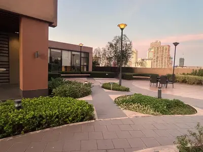 a building with a courtyard with tables and chairs at Bayview near PICC CCP starcity OKADA Airport MOA in Manila