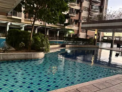 a swimming pool in front of a building at Bayview near PICC CCP starcity OKADA Airport MOA in Manila