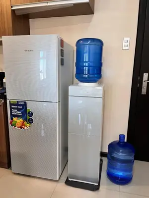 a refrigerator with a blue bucket on top of it at Bayview near PICC CCP starcity OKADA Airport MOA in Manila