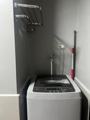 a stove top oven in a small kitchen at Sundawn RadianceManilaBay in Manila