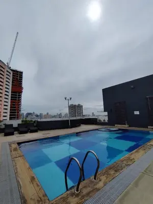 a large swimming pool on the roof of a building at Yuanhang 1508 in Manila