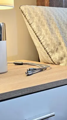a pair of pens sitting on a wooden desk at Guest Favorite House in Biñan in Biñan