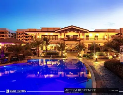 a large building with a swimming pool in front of it at 3BR Resort Style Condo in Manila
