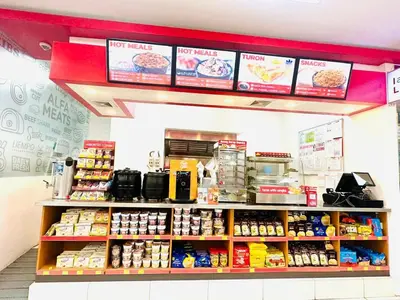 a store with a counter with food on it at Cozy Two Bedroom Family Suites at Coast Residences near PICC, WTC & MOA in Manila