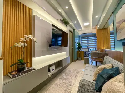 a living room with a couch and a tv at Family suite by SMDC fame residence 5 mins to Shaw mrt,megamall,ortigas in Manila