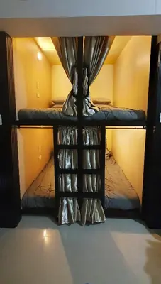 a top bunk bed with a canopy in a room at C Place - Capsule B - Upper in Manila