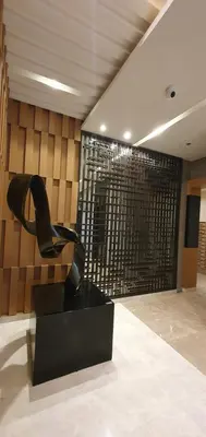 a sculpture of a pair of shoes in a room at C Place - Capsule B - Upper in Manila