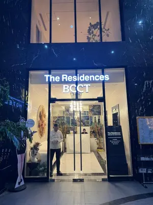 a man standing in the doorway of a store at Cozy 1 Studio Room - The Residences BGC Taguig in Manila