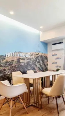 a dining room with a table and chairs at California Themed Condo in BGC in Manila